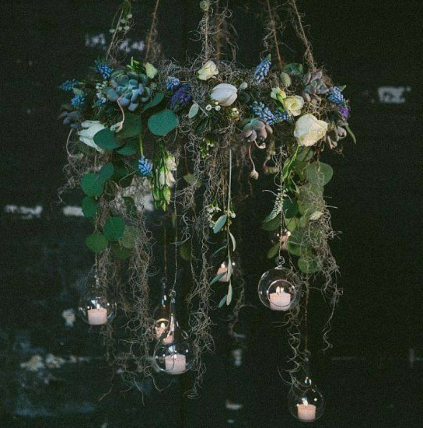 hanging floral arrangement with candles